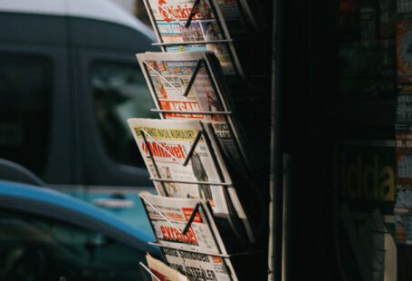 Shopping Spots - A newspaper rack with a lot of newspapers on it