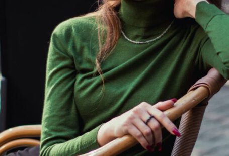 Street Café - Brunette Woman Posing in Green Turtleneck Sweater and Black Skirt